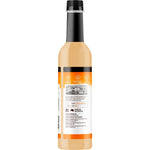 Side view of a 750ml bottle of Buderim Ginger No Sugar Ginger Refresher Cordial with a white and green label.