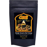 20-pack of Organic Chunky Turmeric Chai tea bags in a white and yellow box with loose spices.