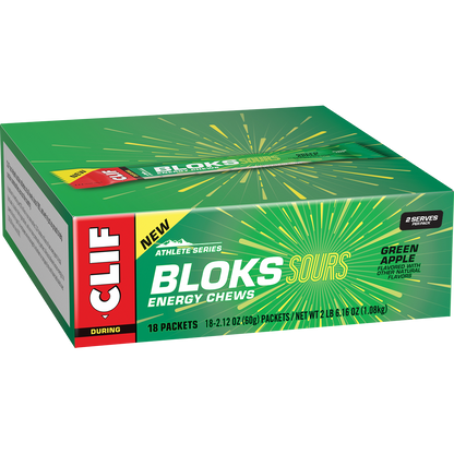 Green and white retail display box containing 18 packets of CLIF Bloks Sour Green Apple energy chews.
