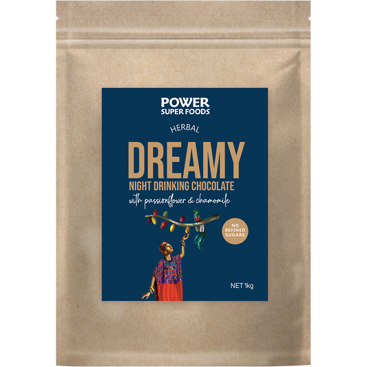 1kg bag of Power Super Foods Dreamy Night Drinking Chocolate with a dark purple label and cacao illustrations.