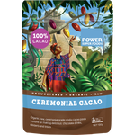 100g black pouch of Power Super Foods Cacao Paste Buttons with gold accents and a small circular window.