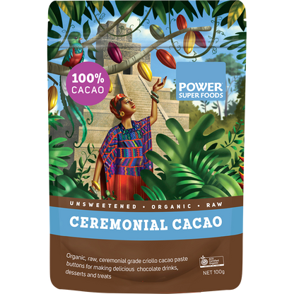 100g black pouch of Power Super Foods Cacao Paste Buttons with gold accents and a small circular window.