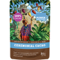 100g black pouch of Power Super Foods Cacao Paste Buttons with gold accents and a small circular window.