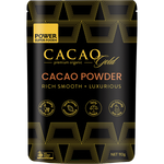 110g pouch of Power Super Foods Cacao Gold Powder with a black and gold label featuring a cacao pod illustration.