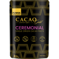 Black pouch of Power Super Foods Cacao Gold Paste Chunks with gold accents and a window showing dark cacao chunks.