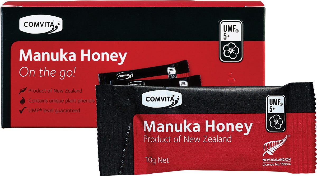 Comvita Manuka Honey UMF 5+ On The Go box and individual 10g sachets against a white background.