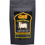 150g tub of Instant Karma Organic Chai Latte featuring a brown label with botanical spice illustrations.