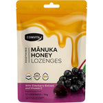 Comvita Manuka Honey Lozenges 12-pack with Elderberry and Vitamin C in a purple box with honey and berry illustrations.
