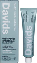 Davids Peppermint Whitening Toothpaste tube and box with metal tube squeezer on a white background.