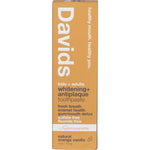 Orange and white boxed packaging for Davids Orange Vanilla whitening toothpaste on a white background.