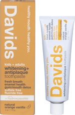 Davids Orange Vanilla whitening toothpaste tube, boxed packaging, and a metal tube key on a white background.