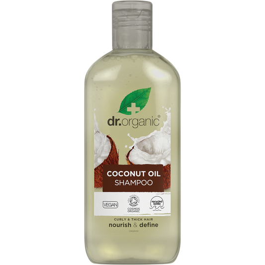 265ml bottle of Dr Organic Virgin Coconut Oil Shampoo with a white pump and tropical-themed label.