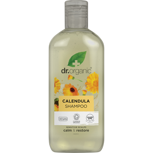 265ml bottle of Dr Organic Calendula Shampoo, fragrance-free for sensitive scalps, featuring yellow floral accents.