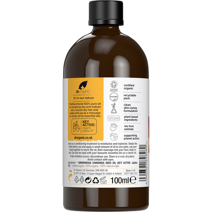Back of Dr Organic 100% Pure Jojoba Oil 100ml glass bottle showing product details and directions on a white background.