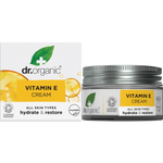 50ml jar and box of Dr Organic Vitamin E Cream featuring orange accents and botanical illustrations on a white background.