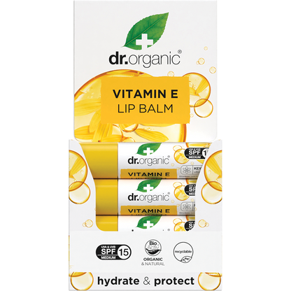 Dr Organic Vitamin E Lip Balm with SPF 15 in a white and green plastic tube and matching display box.
