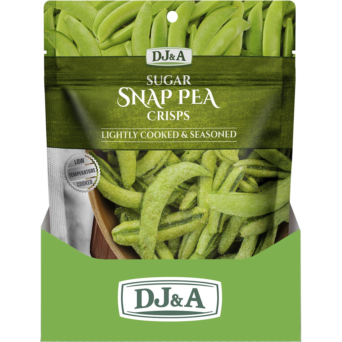 A handful of green DJ&A Sugar Snap Pea Crisps shown against a light green background.