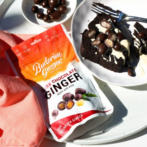 Buderim Ginger Dark Chocolate Ginger 125g bag with ginger chunks enrobed in dark chocolate on a white background.