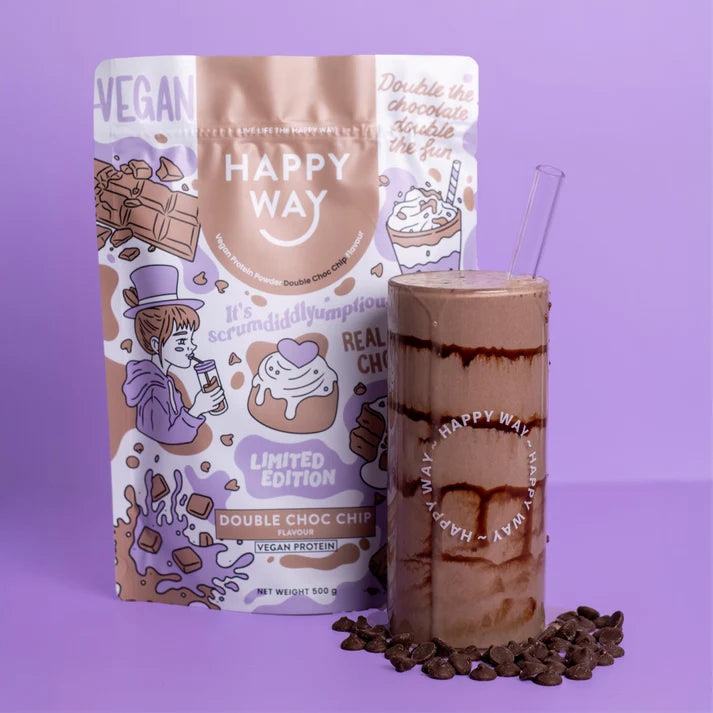 Smooth chocolate smoothie in a glass topped with chocolate chips next to a 500g bag of Happy Way Vegan Protein Powder.
