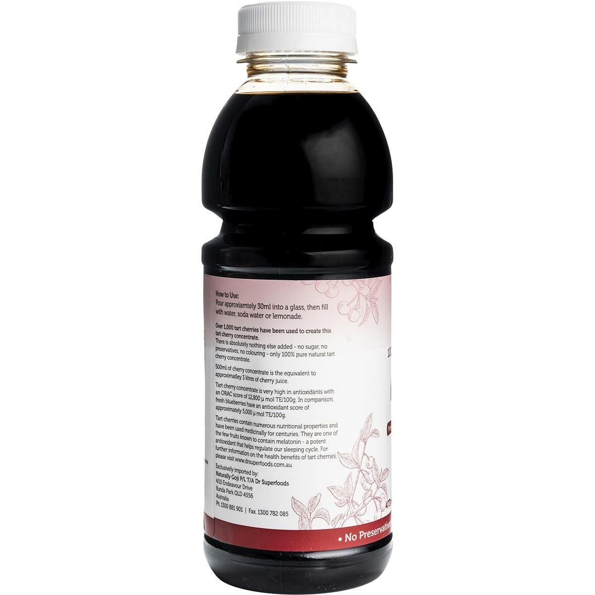 Close-up of the red label on a Dr Superfoods Tart Cherry Concentrate bottle featuring a cluster of fresh cherries.