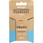 Dr Tung's Smart Vegan Dental Floss with activated charcoal and lemongrass in a black and green paperboard dispenser.