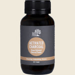 White tub of Eden Healthfoods Activated Charcoal 60 capsules with a black and white label on a clean background.