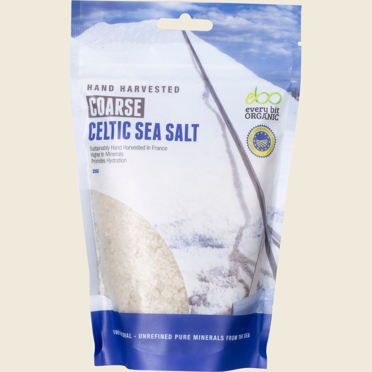 250g bag of Every Bit Organic Celtic Sea Salt Coarse featuring moist, grey salt crystals and botanical illustrations.
