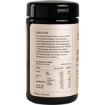 Evolution Botanicals Organic Holy Basil 100g glass jar with a black lid and white botanical labels.