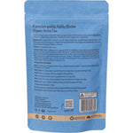 Loose organic UriTract herbal tea blend with dried botanicals, roots, and orange peel on a white background.