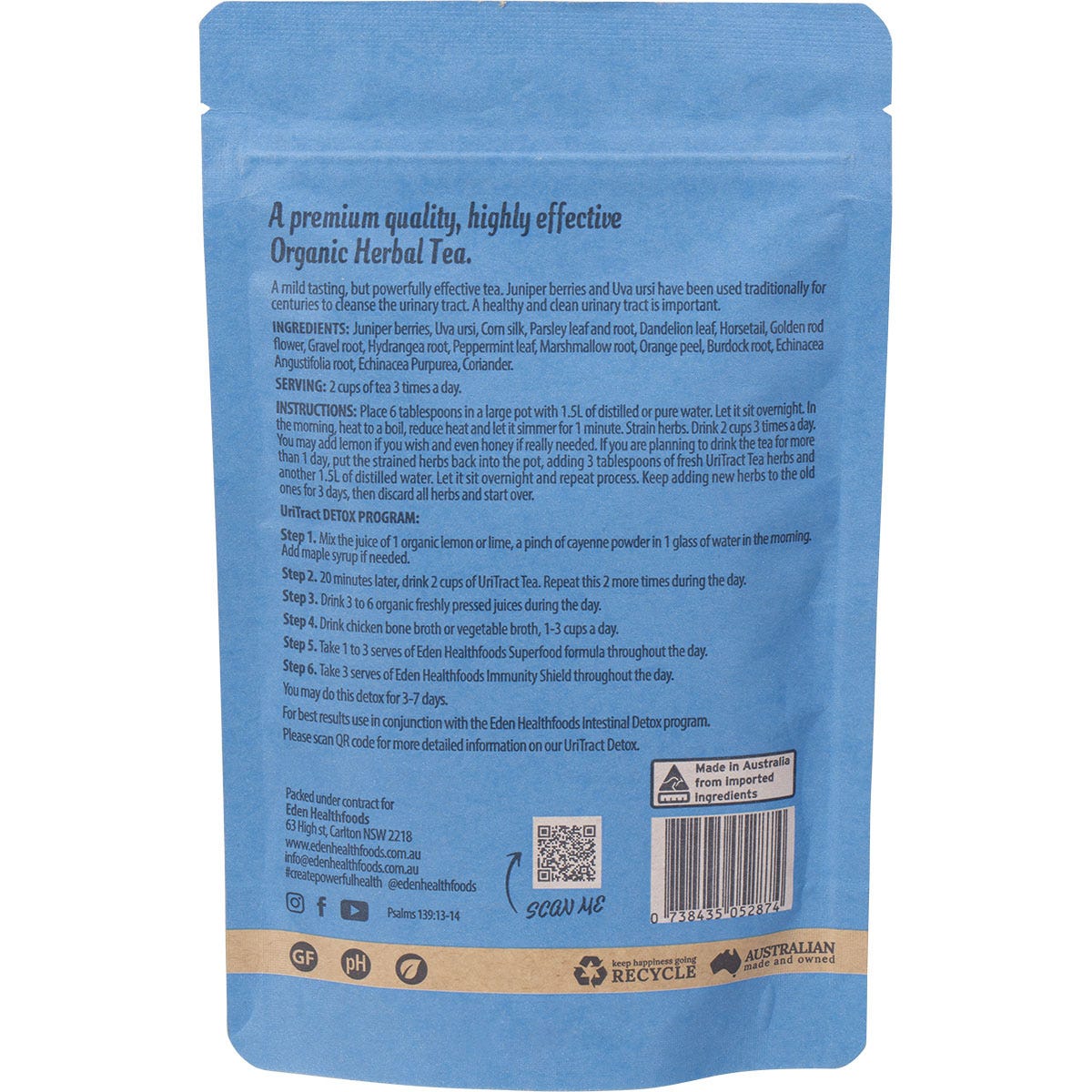 Loose organic UriTract herbal tea blend with dried botanicals, roots, and orange peel on a white background.
