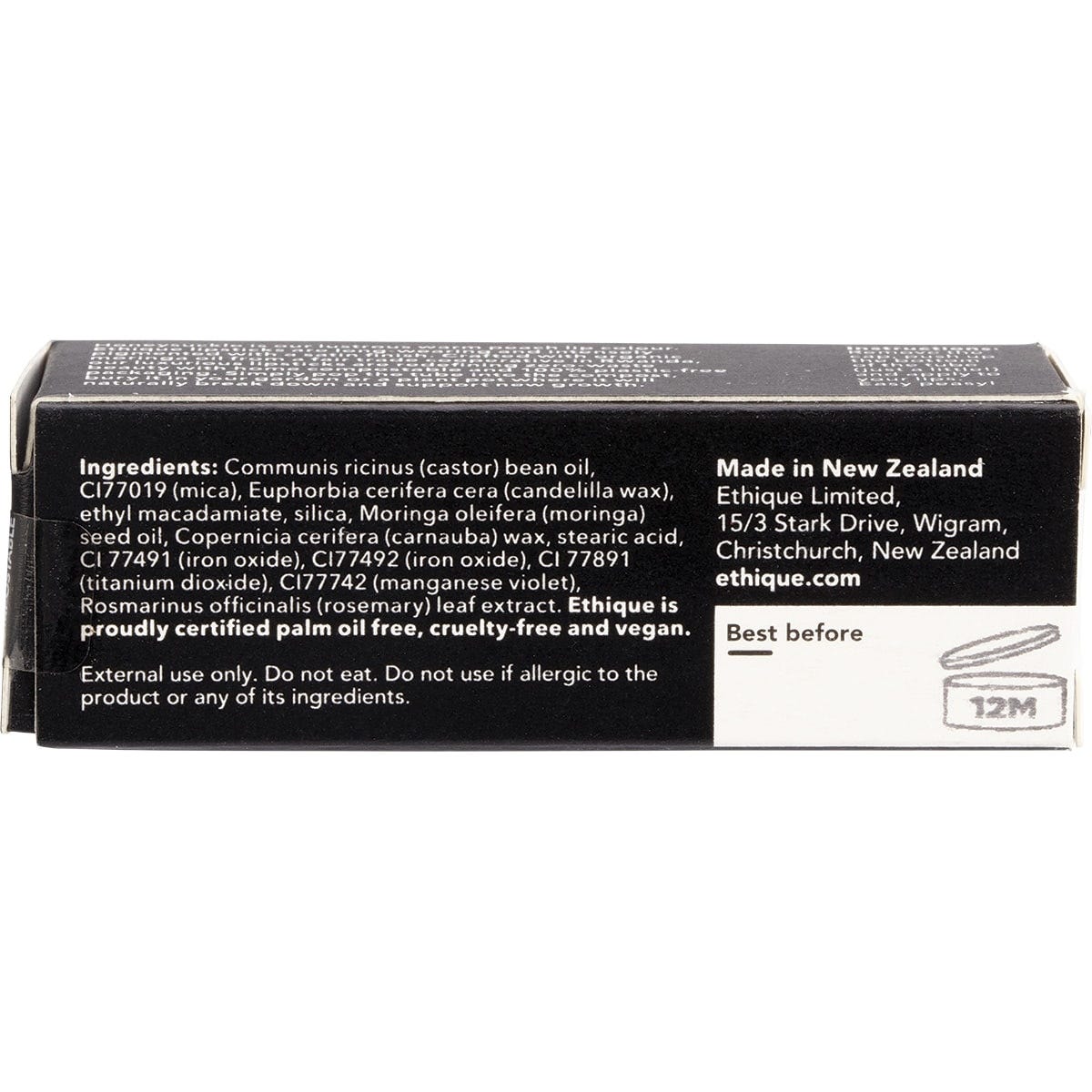 Ethique Honeysuckle warm peach lipstick in a sustainable cardboard tube, shown from a side-angled perspective.