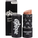 Ethique Honeysuckle lipstick in a peach-toned shade, packaged in a sustainable, push-up cardboard tube.