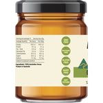 Side view of a 325g jar of Every Bit Organic Raw Honey showing nutritional facts and certified organic logos.