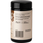 Open violet glass jar of Evolution Botanicals Aged Fermented Black Garlic extract powder showing its dark, fine texture.