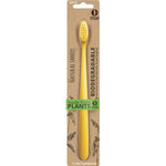 Close-up of assorted NFco Bio Toothbrushes with neon handles and soft bristles on a white background.