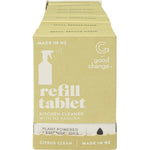 Good Change Store Kitchen Cleaner refill tablets and box on a wooden surface with a spray bottle and orange.