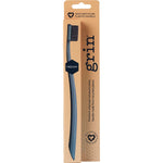 Grin 100% recycled medium toothbrushes in pink and charcoal with charcoal-infused bristles.