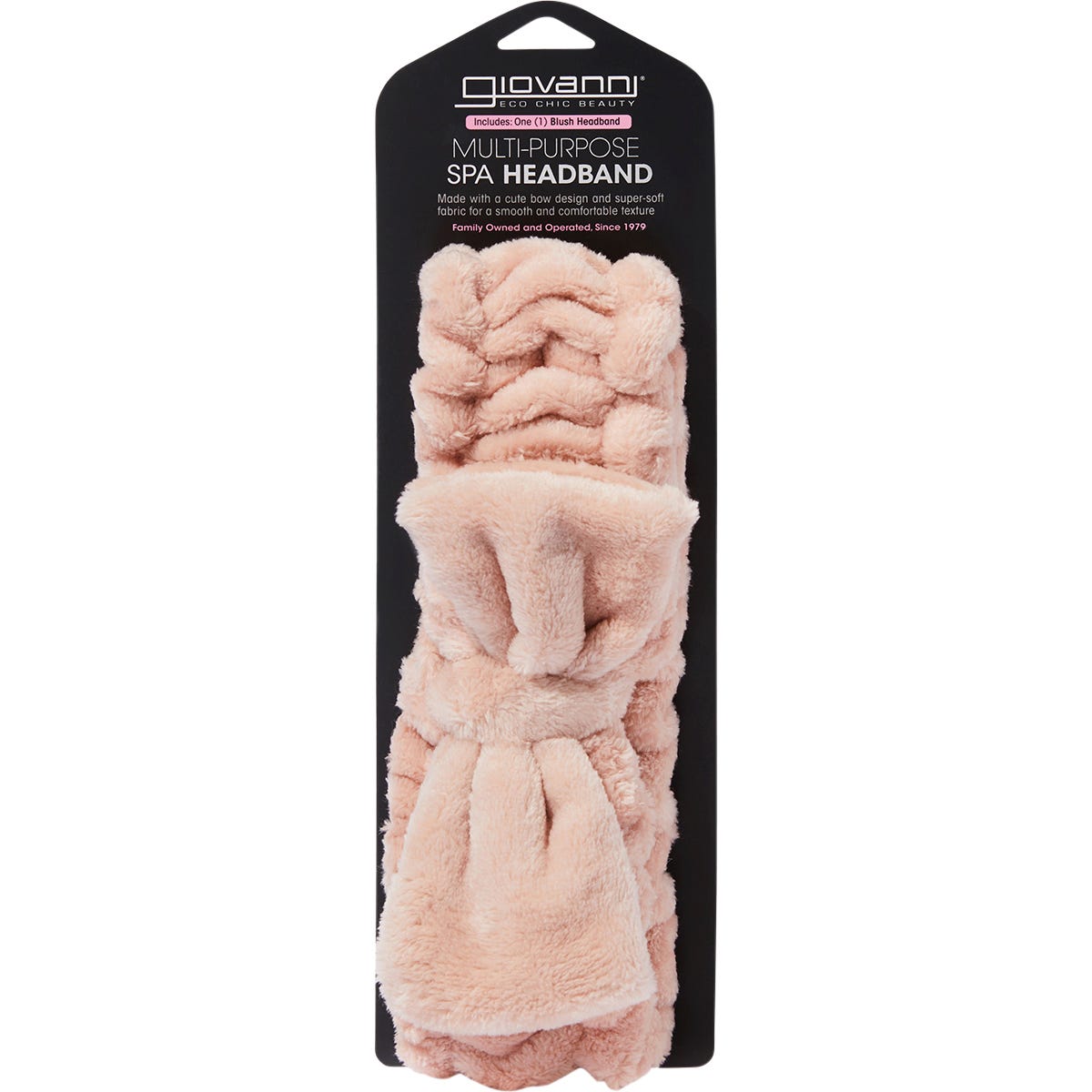 Plush blush pink Giovanni spa headband with a decorative bow on a white background.