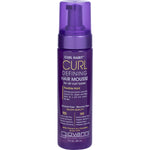 Giovanni Curl Habit Defining Hair Mousse 207ml bottle with a purple and white label featuring botanical leaf patterns.