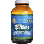 Green Nutritionals Mountain Organic Spirulina 180 vegan capsules in an amber glass bottle on a white background.