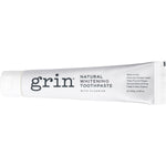 100g tube of Grin Natural Whitening Toothpaste with Fluoride shown against a light blue and white product box.