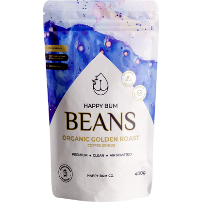 A 400g bag of Happy Bum Organic Golden Roast Enema Coffee with a light tan and gold label.