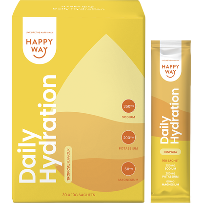 Happy Way Tropical Hydration box with a single sachet, a glass of yellow liquid, and fresh mango and coconut.