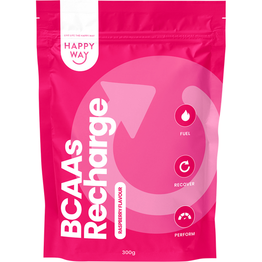 Pink supplement package labeled BCAA Recharge with Happy Way branding and a smiling emoji with tongue.