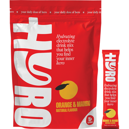 Orange Mango Hyro Electrolyte box, 15 individual sachets, and a glass of prepared drink with orange and mango slices.