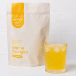 250g tub of Happy Way Tropical Marine Collagen Powder on a blue and orange background with tropical fruit.
