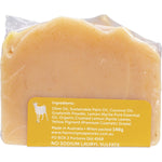 Handmade 140g bar of Harmony Soapworks Lemon Myrtle Goat's Milk Soap with crushed leaves on a white background.