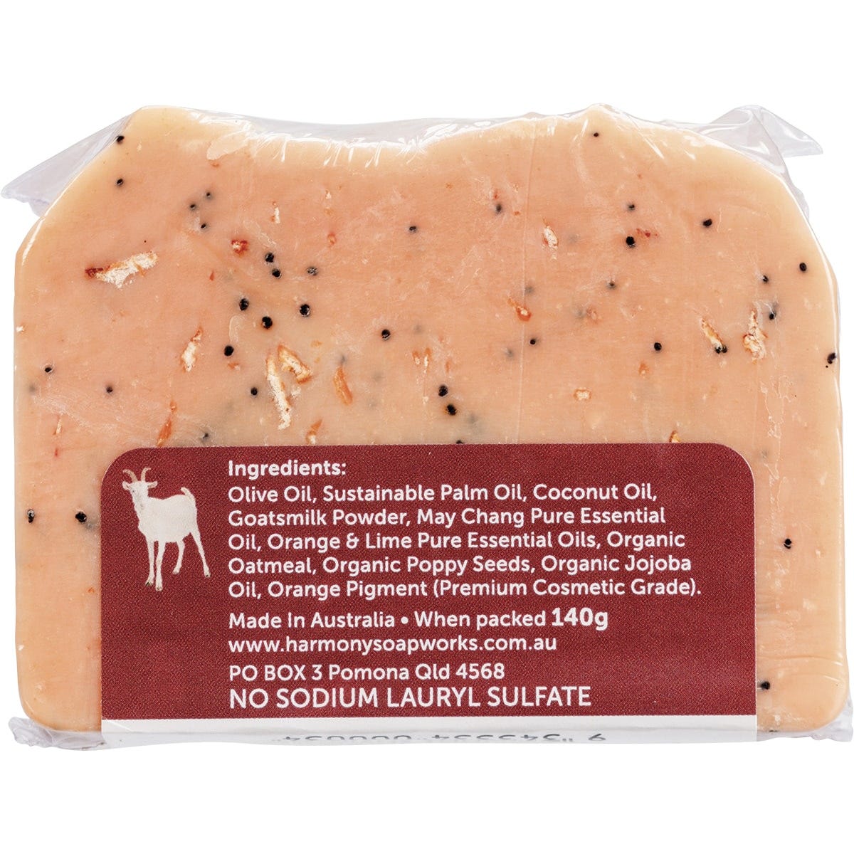 Handmade Harmony Soapworks May Chang goat's milk soap bar with oatmeal and poppy seeds on a white background.