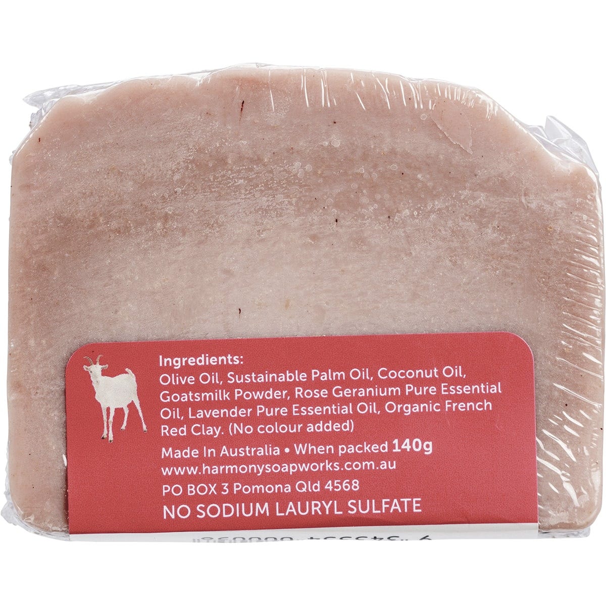 Harmony Soapworks Rose Geranium Goat's Milk Soap 140g bar with red clay on a white background.