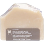 Unwrapped bar of Harmony Soapworks unscented goat's milk soap on a white background.